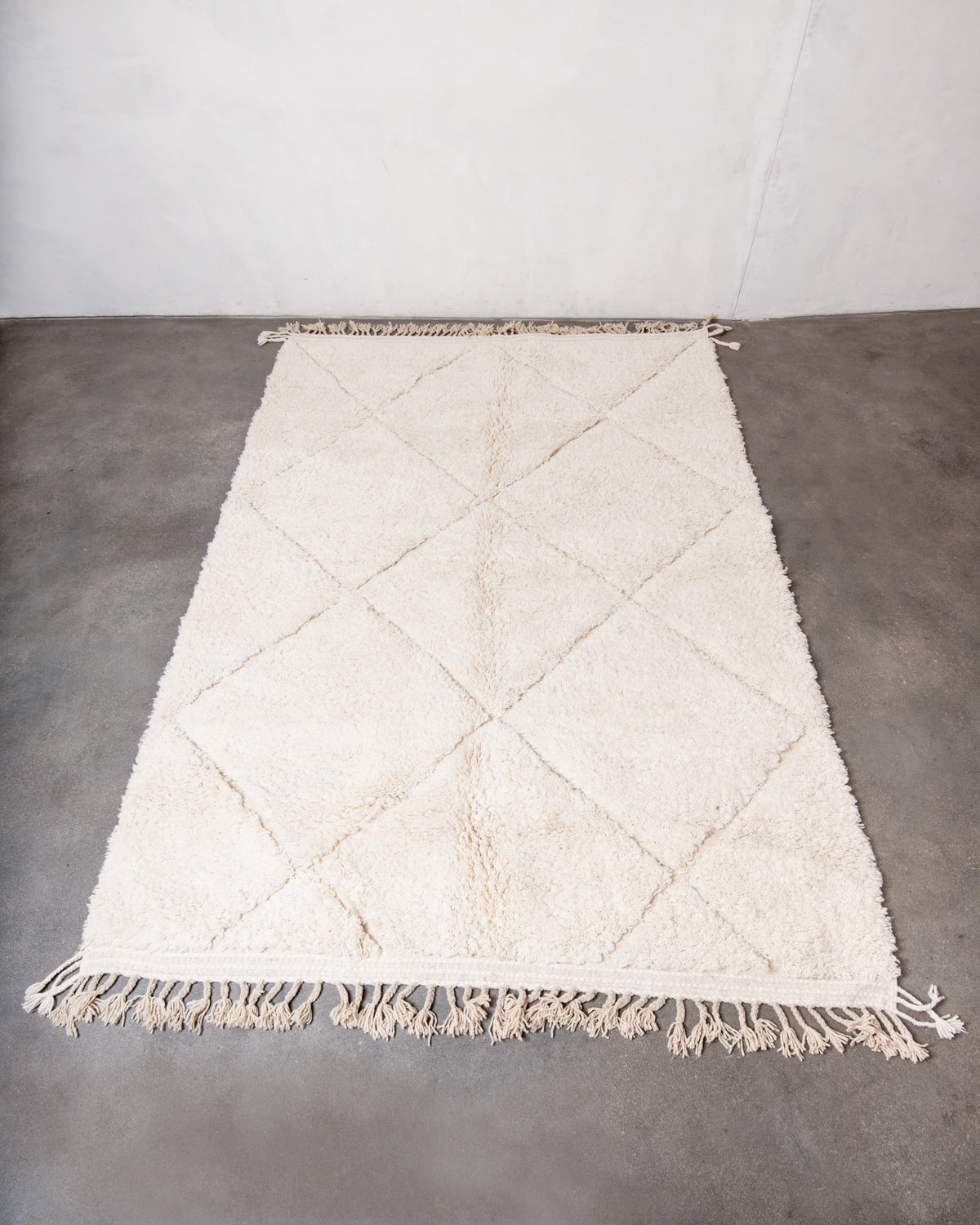 Modern, designer, handcrafted Berber rug from Morocco. Beniourain carpet with minimalist design, natural wool pile and a fluffy texture.